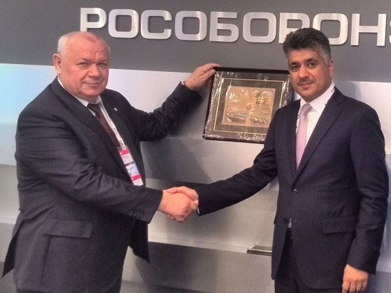His Excellency Engineer Kamal bin Ahmed Mohammed, Minister of Transportation and Telecommunications for the Kingdom of Bahrain with representative from Rosoboronexport (© Copyright 2015 Bahrain International Airshow)