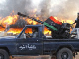Libyan Rebels Storm Qaddafi’s HQ
