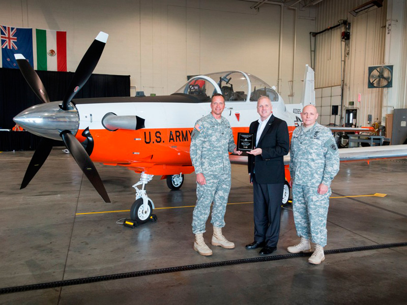 Pictured left to right: COL Steve Clark, U.S. Army Fixed Wing Project Manager, Dan Grace, Vice President, Business Development, Defense Company and COL Patrick Mason, Commander, RTC
